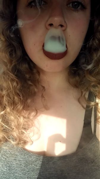 gorgeous girls exhaling smoke