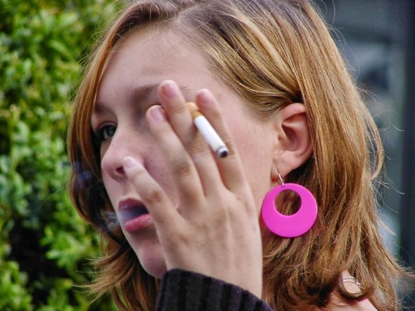 girl smoking just with lips