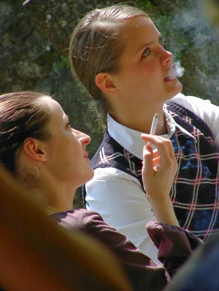 woman inhale cigar smoke