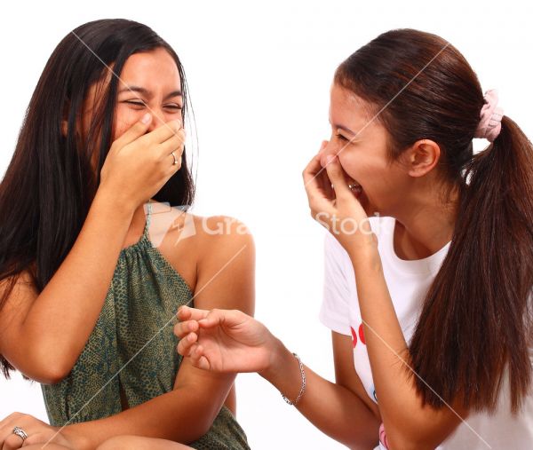 women laughing mocking