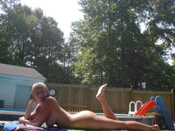 wife tanning nude in back yard