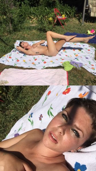 women tanning in back yard
