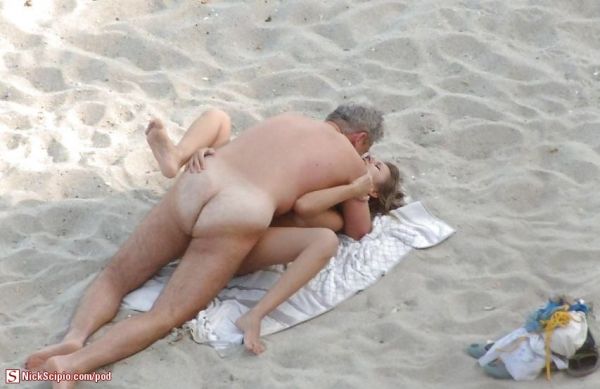 couple kissing night beach