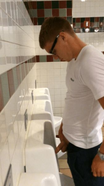 blacks guys peeing in urinal