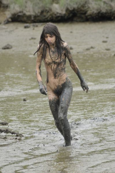 teen girls playing in mud