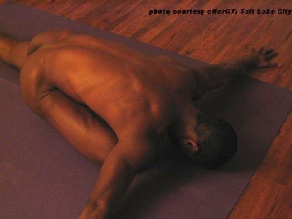 naked man doing yoga