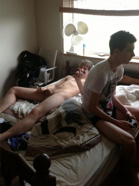 gay men kissing in bed