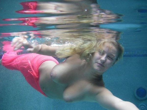 busty redhead topless underwater