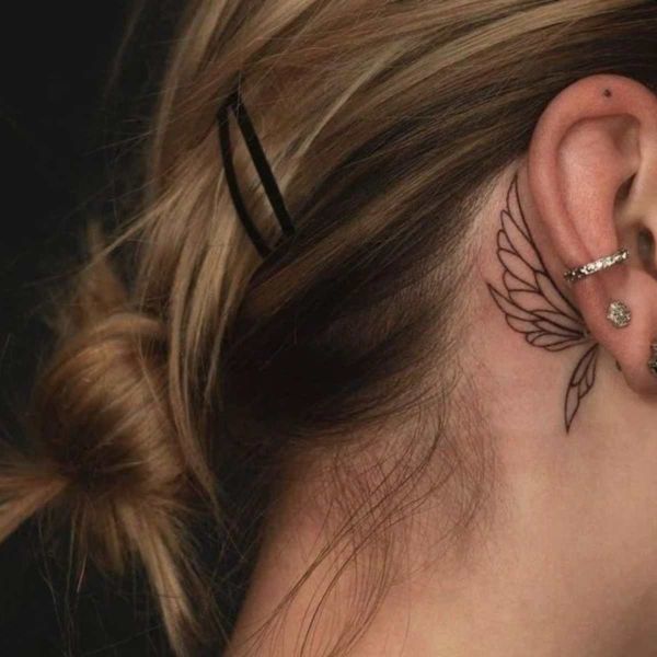 butterfly tattoo behind the ear