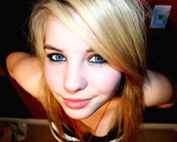 smiling blonde woman with blue eyes