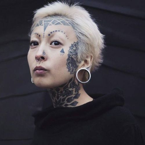 cross face tattoo