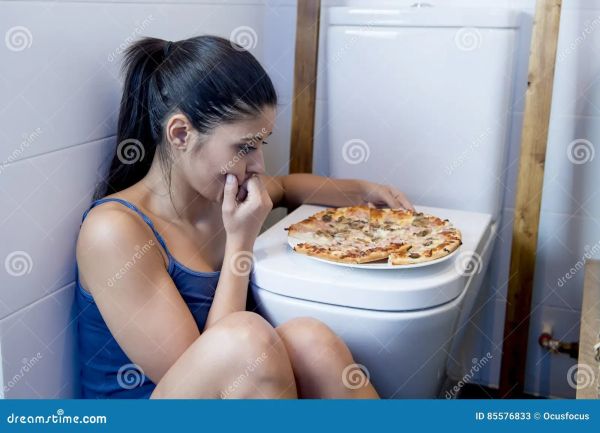 person sick next to toilet