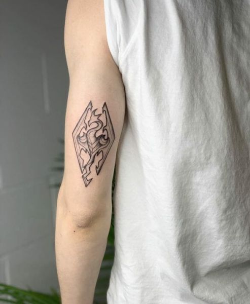 arrow on leg tattoo