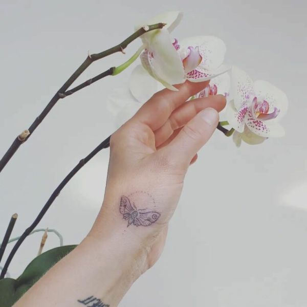 writing on hand tattoo