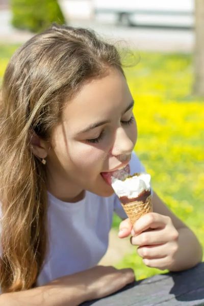 girl eating fruit and yogurt