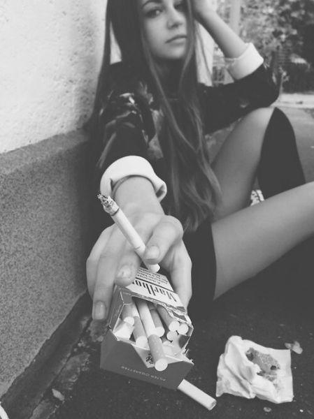girl rolling weed