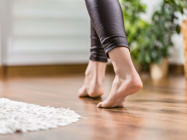 woman running barefoot