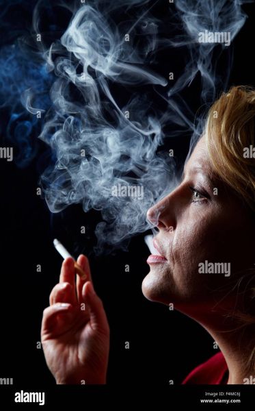 dimpled chin sxhaling smoke