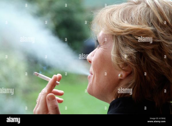 scary woman smoking cigarette