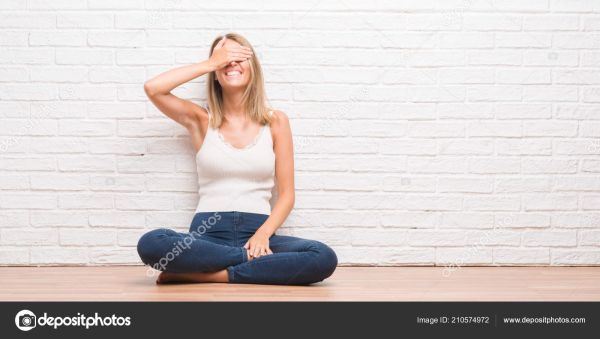 man faces sits woman